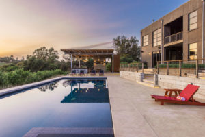 The family enjoys spending much of their time in the outdoor living space designed and executed by landscape architects Merge Studio Inc.