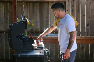 Justin Gill adds his Bachan's Japanese Barbecue Sauce onto grilled rib-eye in Santa Rosa on Wednesday, Sept. 11, 2019. (Christopher Chung/ The Press Democrat)